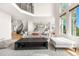 Bright, open-concept living room with a large picture window and stylish, neutral-toned furniture at 6635 Tremolite Dr, Castle Rock, CO 80108