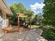 Backyard featuring a covered deck and mature trees at 12420 W Atlantic Ave, Lakewood, CO 80228