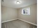Neutral bedroom features a carpeted floor, one window, and neutral colored walls and trim at 12420 W Atlantic Ave, Lakewood, CO 80228