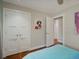 Bedroom with white double doors, recessed lighting, and a view of the hallway at 12420 W Atlantic Ave, Lakewood, CO 80228