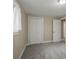 Bedroom with carpet, white trim, a closet, and natural light from the window at 12420 W Atlantic Ave, Lakewood, CO 80228