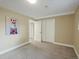 Bedroom with carpet, double doors, and a llama picture on the wall at 12420 W Atlantic Ave, Lakewood, CO 80228