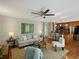 Open-concept living room and kitchen area with hardwood floors and an airy feel at 12420 W Atlantic Ave, Lakewood, CO 80228