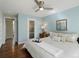 Comfortable main bedroom featuring a ceiling fan and light-blue walls at 12420 W Atlantic Ave, Lakewood, CO 80228