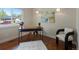 Bright home office features wood floors, modern decor, and large window with natural light at 12420 W Atlantic Ave, Lakewood, CO 80228