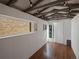 The shed has white paneled walls, a wood floor, and windows at 12420 W Atlantic Ave, Lakewood, CO 80228