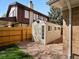 Backyard shed with a new coat of paint, fenced perimeter, and gravel base at 12420 W Atlantic Ave, Lakewood, CO 80228