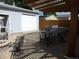 Outdoor patio with a built-in grill, dining set, and a cozy fire pit area at 4353 Wolff St, Denver, CO 80212