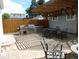 Outdoor patio with grill, dining set, fire pit, and pergola at 4353 Wolff St, Denver, CO 80212