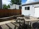 Inviting patio with outdoor seating, a firepit, and a lovely garden area at 4353 Wolff St, Denver, CO 80212
