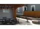 Cozy outdoor patio space, complete with a dining set, fire pit, and landscaping at 4353 Wolff St, Denver, CO 80212