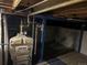 Basement interior featuring the home's water heater, with exposed piping and electrical at 4353 Wolff St, Denver, CO 80212