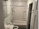 Bathroom features a shower-tub combination with white tiled walls at 4353 Wolff St, Denver, CO 80212