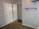 Bedroom features a mirrored closet and open shelving above the carpet floor at 4353 Wolff St, Denver, CO 80212