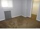 Bright bedroom with neutral carpet, radiator, and closet space at 4353 Wolff St, Denver, CO 80212