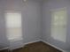 Bedroom with bright windows, radiator, and plush carpet provides a cozy retreat at 4353 Wolff St, Denver, CO 80212