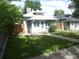 Charming bungalow with a well-manicured lawn, porch, and light gray siding at 4353 Wolff St, Denver, CO 80212