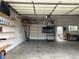Inside of garage with pegboard, workbench, television and shelving at 4353 Wolff St, Denver, CO 80212