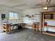 Inside of garage with pegboard, workbench and shelving at 4353 Wolff St, Denver, CO 80212
