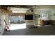 Spacious garage featuring an attached outdoor patio area, storage shelves, and ample workspace for projects and hobbies at 4353 Wolff St, Denver, CO 80212