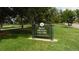 Sign for Rocky Mountain Lake Park, framed by green grass and mature trees, inviting nature lovers at 4353 Wolff St, Denver, CO 80212