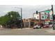 Neighborhood view showing various stores and shops in a vintage brick building setting at 4353 Wolff St, Denver, CO 80212