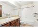 Bathroom featuring a tub with shower, and vanity providing a functional and clean space at 10102 W Ida Ave # 214, Littleton, CO 80127