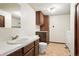 Bathroom features a vanity, toilet, and washer-dryer hookups, providing a convenient and functional layout at 10102 W Ida Ave # 214, Littleton, CO 80127