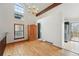 Dining room features hardwood floors, exposed beam ceilings, and a decorative vintage chandelier at 10102 W Ida Ave # 214, Littleton, CO 80127