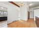 Bright dining room boasts hardwood floors, a beam ceiling, and vintage chandelier lighting at 10102 W Ida Ave # 214, Littleton, CO 80127