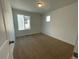 Bright bedroom with neutral carpeting and large window at 5598 Wisteria Ave, Firestone, CO 80504