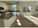 Bright kitchen with stainless steel appliances and sliding glass doors at 5598 Wisteria Ave, Firestone, CO 80504