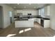 Modern kitchen featuring stainless steel appliances and an island at 5598 Wisteria Ave, Firestone, CO 80504