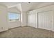 Neutral bedroom with vaulted ceilings, a sunny window, and a closet at 11085 Huron St # 1108, Northglenn, CO 80234