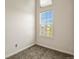 Bright bedroom with neutral carpet and a window offering natural light and pleasant views at 11085 Huron St # 1108, Northglenn, CO 80234