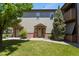 Inviting townhome entrance with well-maintained lawn and charming exterior details at 11085 Huron St # 1108, Northglenn, CO 80234