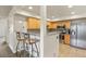 Open kitchen with modern appliances and breakfast bar seating, ideal for entertaining at 11085 Huron St # 1108, Northglenn, CO 80234