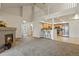 Spacious living room with a fireplace and an open view of the kitchen and dining area at 11085 Huron St # 1108, Northglenn, CO 80234