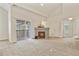 Cozy living room with fireplace and sliding door to the patio for outdoor access at 11085 Huron St # 1108, Northglenn, CO 80234