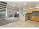 Inviting living room featuring a cozy fireplace, balcony, and a seamless flow into the adjacent kitchen area at 11085 Huron St # 1108, Northglenn, CO 80234