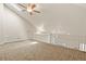 Spacious loft area with carpet and a ceiling fan, perfect for relaxing or entertaining at 11085 Huron St # 1108, Northglenn, CO 80234