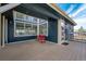 Spacious back deck area with a red bench, sliding doors, and great backyard view at 44626 Lariat Trl, Elizabeth, CO 80107
