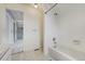 Bathroom with tub and tiled shower and vanity, conveniently situated near the hallway at 44626 Lariat Trl, Elizabeth, CO 80107