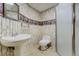 Cozy bathroom with a sink, toilet, and enclosed shower stall at 44626 Lariat Trl, Elizabeth, CO 80107