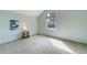 Bedroom with carpet, a bedside table and lamp and large picture window at 44626 Lariat Trl, Elizabeth, CO 80107