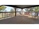Spacious deck area featuring chairs and benches with metal frames overlooking a scenic view at 44626 Lariat Trl, Elizabeth, CO 80107