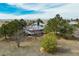 Charming home featuring a wraparound porch, solar panels and surrounded by mature trees on a spacious lot at 44626 Lariat Trl, Elizabeth, CO 80107