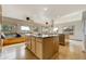 Spacious kitchen with hardwood floors, center island, and built-in window seating at 44626 Lariat Trl, Elizabeth, CO 80107