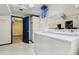 Functional laundry room featuring washer, dryer, and storage cabinets at 44626 Lariat Trl, Elizabeth, CO 80107