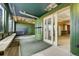 Enclosed sunroom with sliding glass doors, wood paneling, and space for seating at 44626 Lariat Trl, Elizabeth, CO 80107